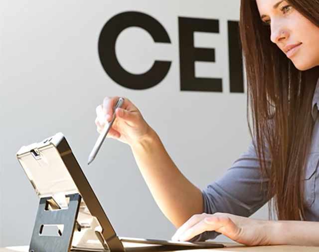 Woman with device and stylus